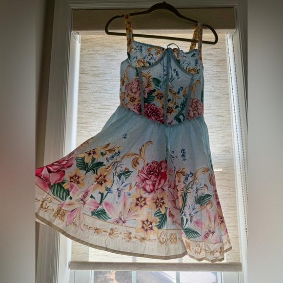 Agua Bendita, Resort Wear
Riveria Radiance Spring Blush Floral Cotton Minidress - Picture 4 of 11